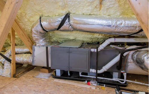 A zoned HVAC system in the attic of a home