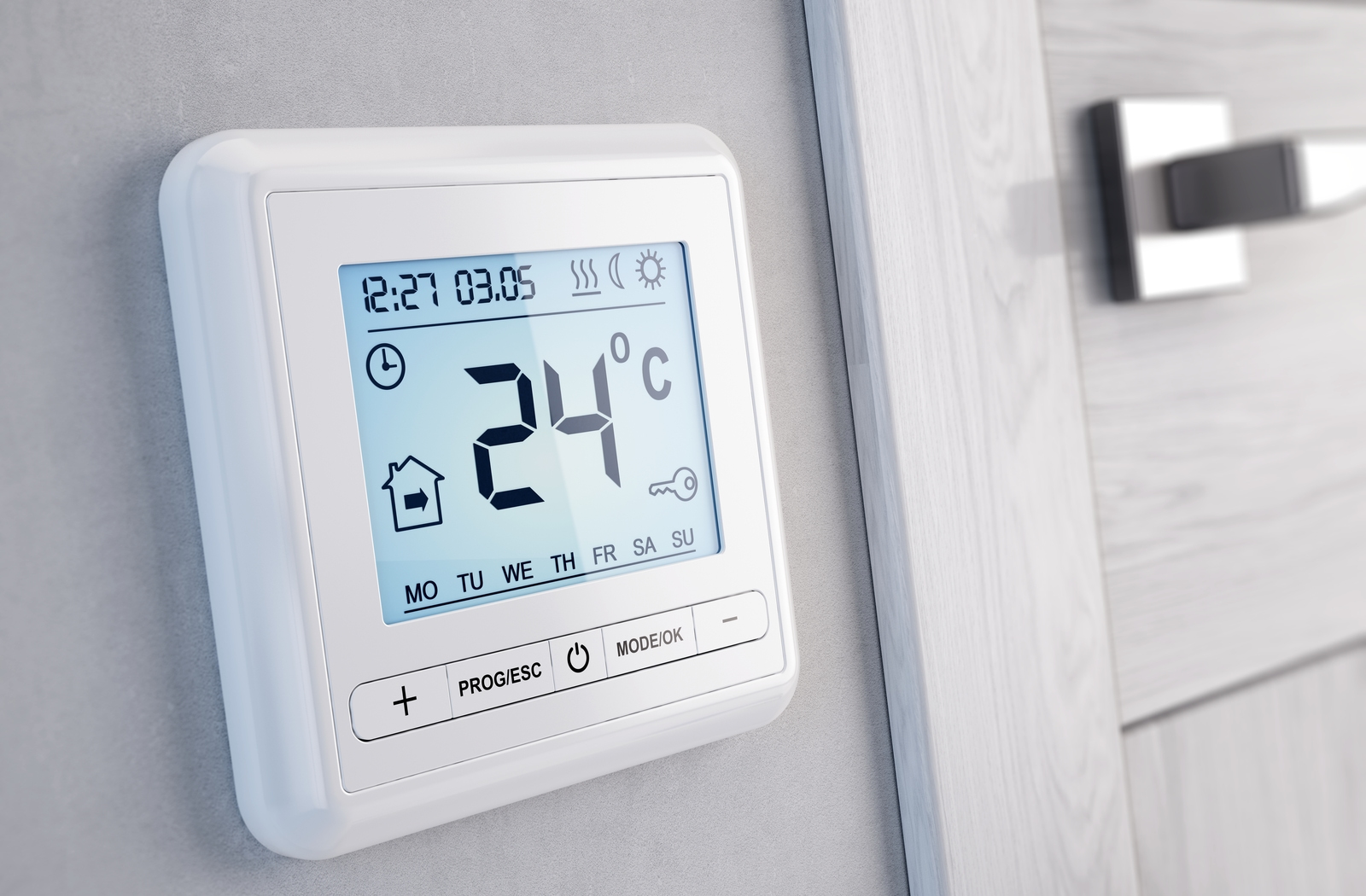 Modern digital programmable Thermostat in home set to 24°C during day time