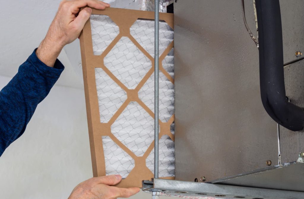 Tech installing furnace filter