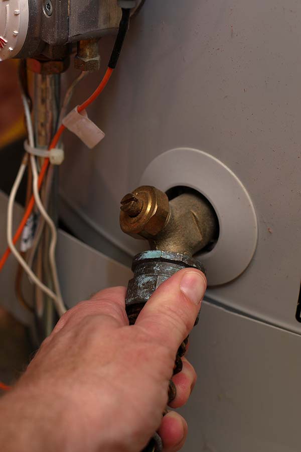 Tech adjusts corroded valve