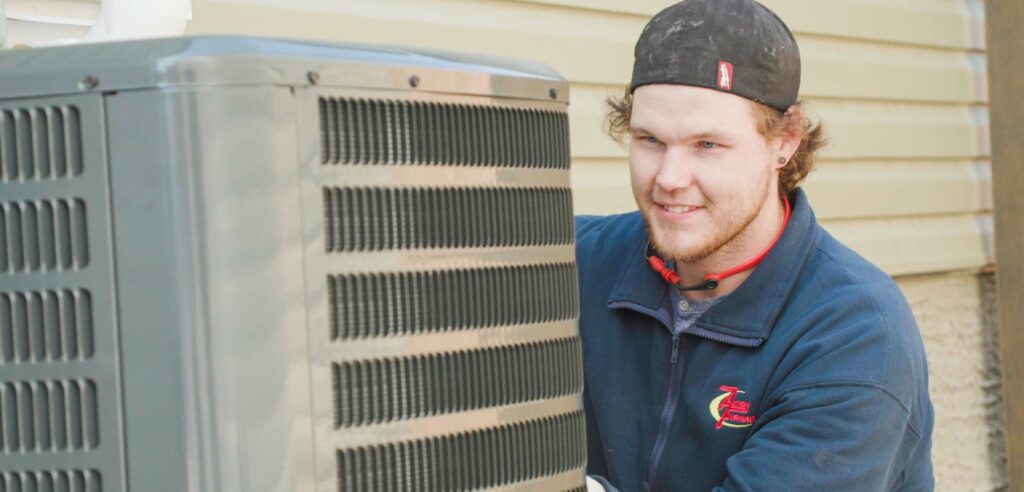 Professional AC Technician installing AC unit at a residential home