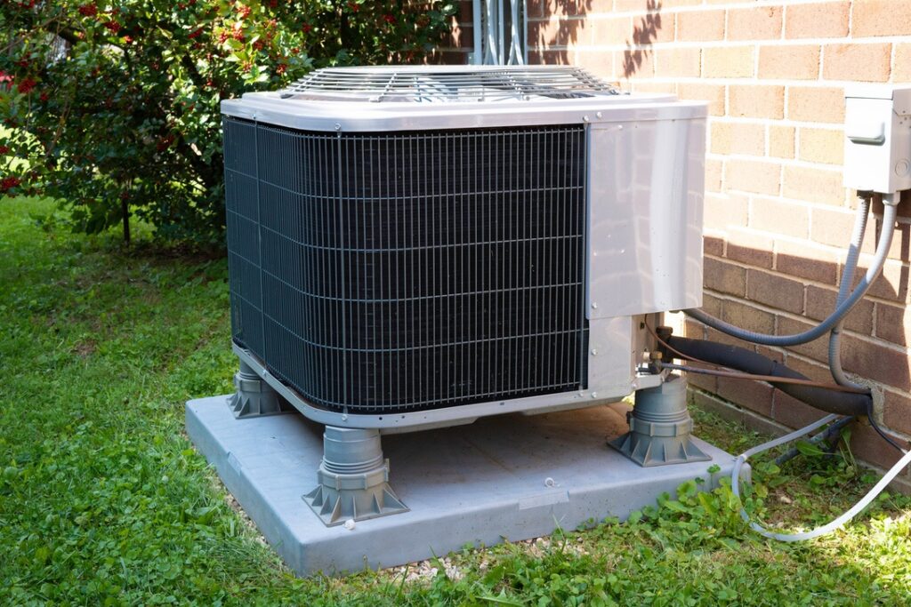 New air conditioner outdoor unit installed near Alberta home