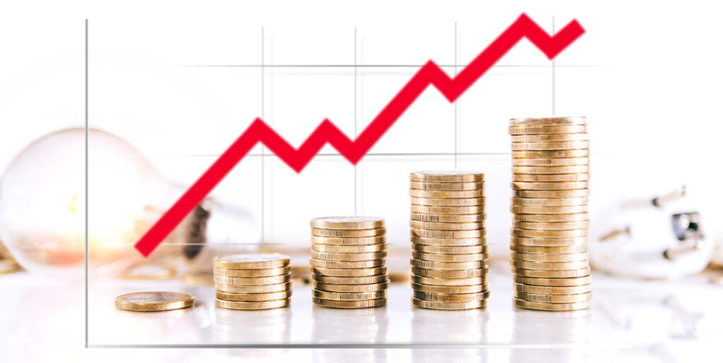 Incrementally larger stacks of gold coins, with red arrow graph, indicating rising costs.