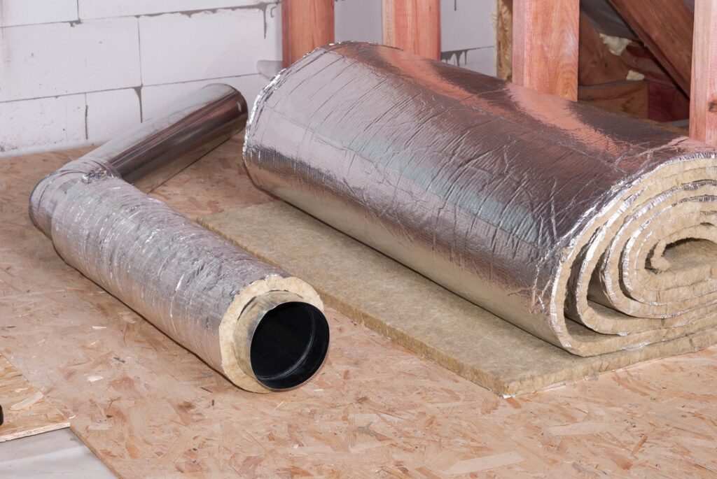 Professionally measured and wrapped sheets of insulation around air ducts in home