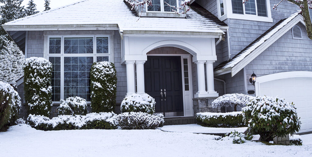 Outside snowy home in winter