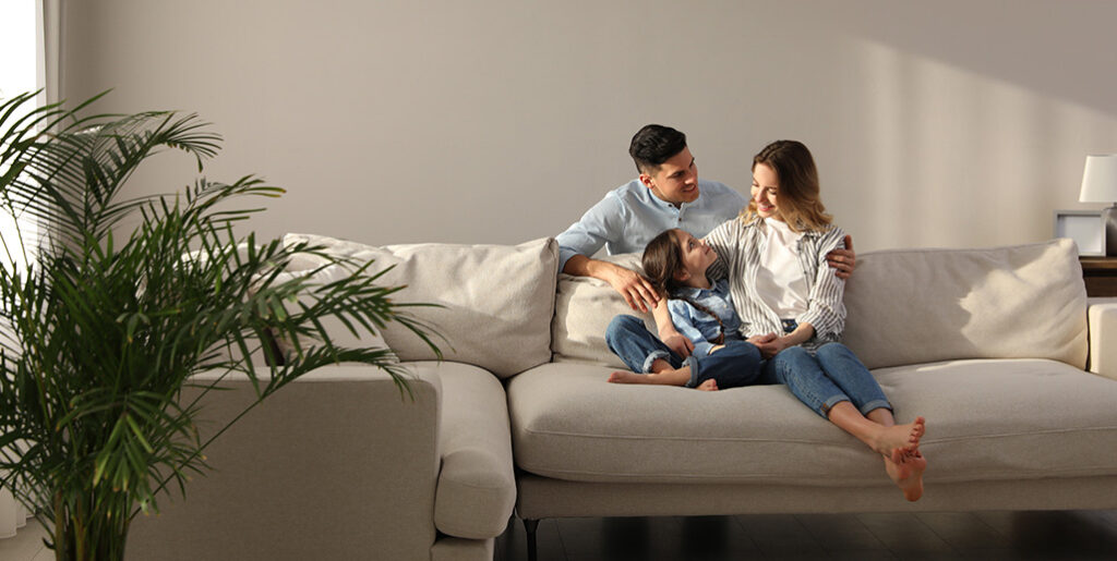 Couple with child on couch