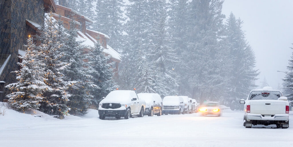 Snowy car lined street