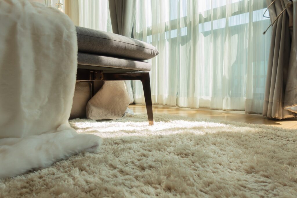 Thick carpet on hardwood floors to trap heat
