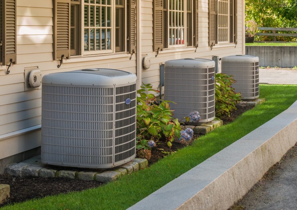 Outdoor AC units by row of condominiums