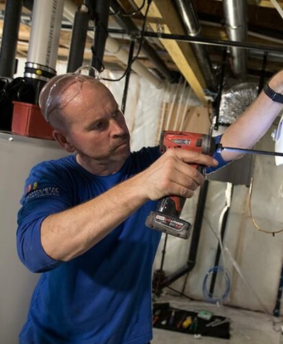 Technician Repairing Furnace