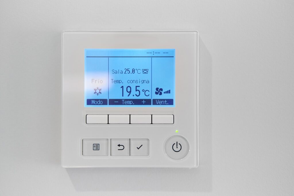 Thermostat with temperature in the ideal range for fall or spring displayed