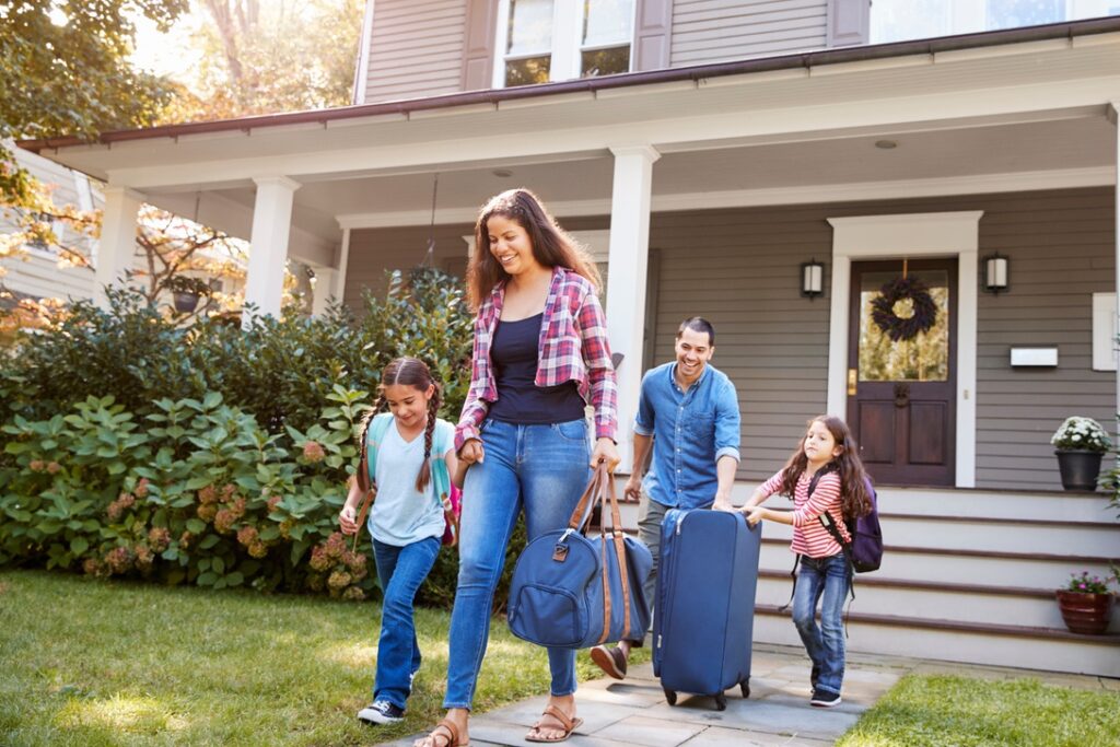 Family going on vacation and leaving home after turning off hot water heater tank