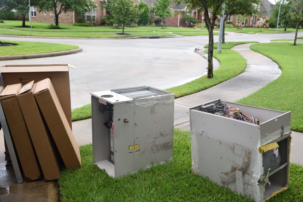 Old furnace equipment being taken away after furnace replacement