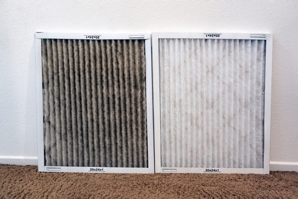 Dirty furnace filter next to clean one