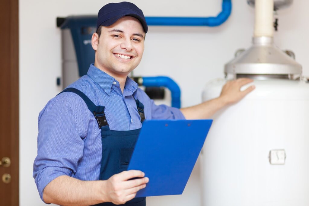 Service technician after installing new hot water heater in home