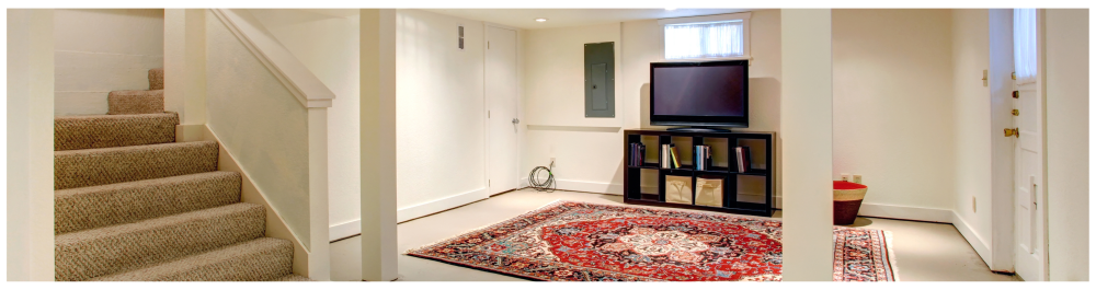 Basement room with a TV, showcasing a finished interior designed for comfort. The space is properly insulated and well-maintained, emphasizing energy efficiency.