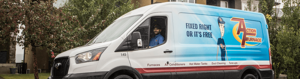 A smiling Action Furnace technician in his van as he leave's an installation appointment. Action Furnace specializes in the installation of modern, energy efficient and smart thermostat compatible furnace, air conditioners and heat pumps.