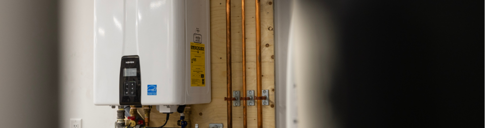 Tankless water heater mounted on a wall.
