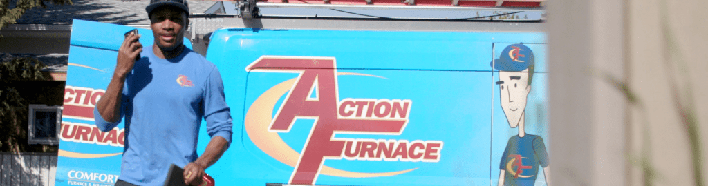 An Action Furnace technician approaches a home. He is on the phone with the homeowner letting them know of his arrival.